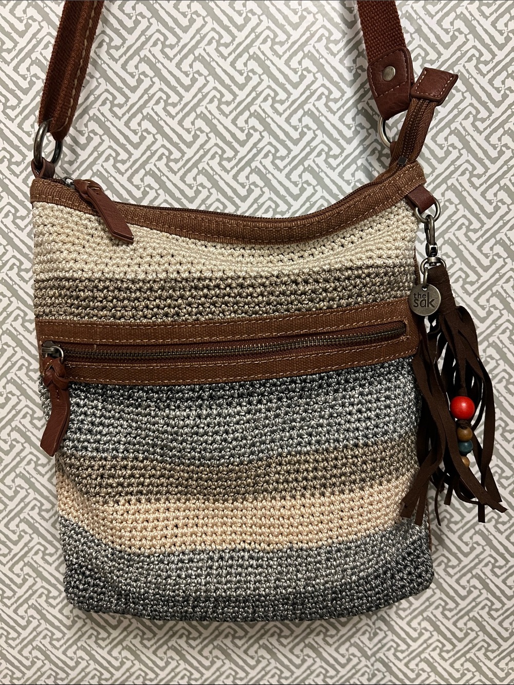 The Sak Striped Crochet Crossbody Bag in Brown, Cream, and Gray